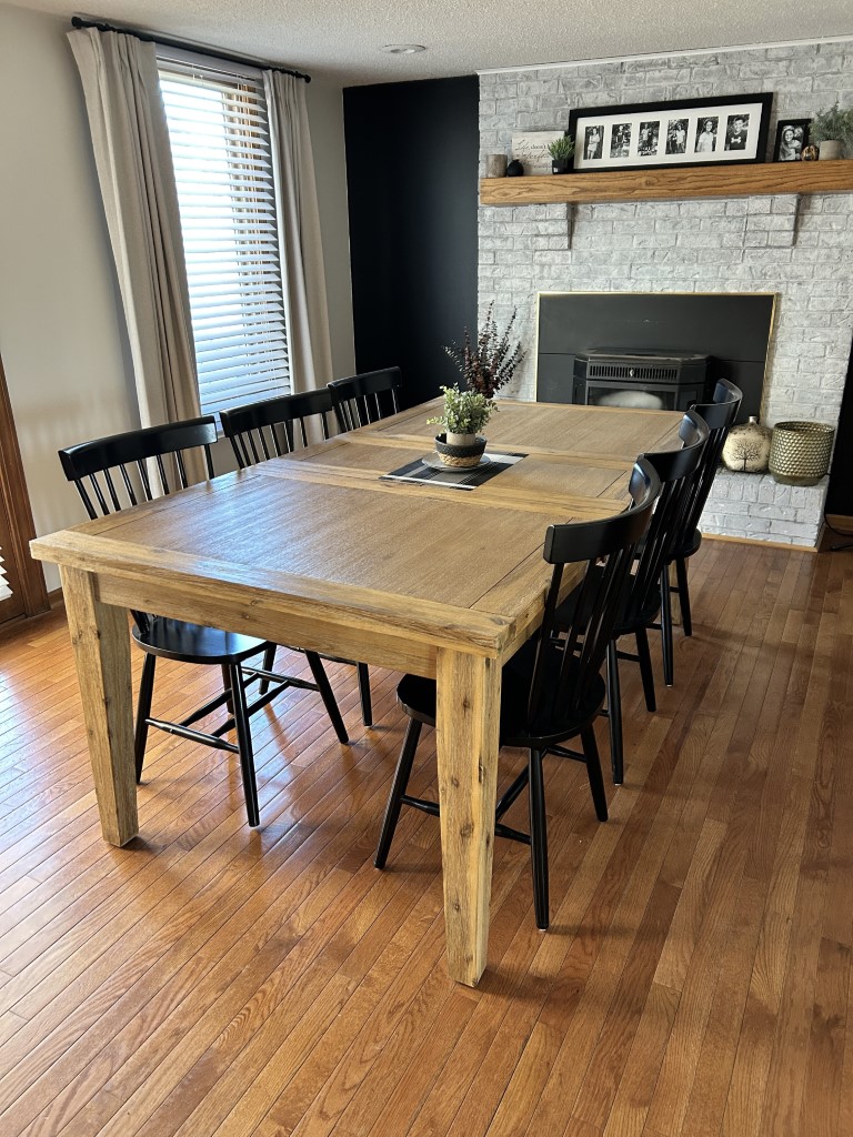 black wooden chairs and natural wood table